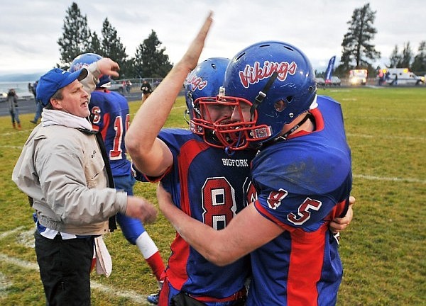 Ian Lorang (center) celebrates the Vikings' Class B Championship with Connor Coleman (45) following the game.