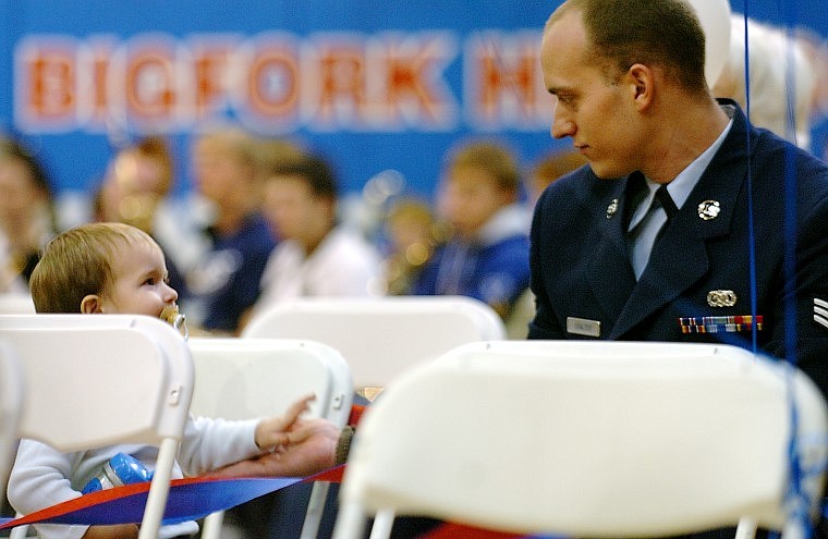 Joe Coulter high-fives his son Joseph Coulter Jr., 2, during Bigfork High School&#146;s Veterans Recognition Assembly on Wednesday morning.