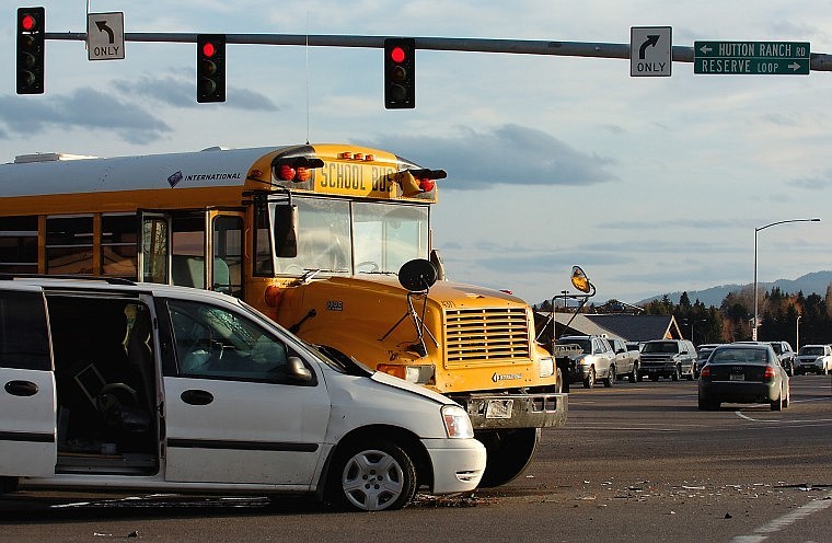 An empty school bus and a minivan collided at the intersection of U.S. 93 and Reserve Loop shortly after 3 p.m. Friday, tying up traffic on the busy highway. The school bus was attempting to turn left in front of the van, which was southbound on U.S. 93, when the collision occurred, according to the Kalispell Police Department. A passenger in the van was injured and taken to Kalispell Regional Medical Center.