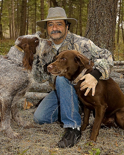 Photographer Nick Fucci poses with his dogs