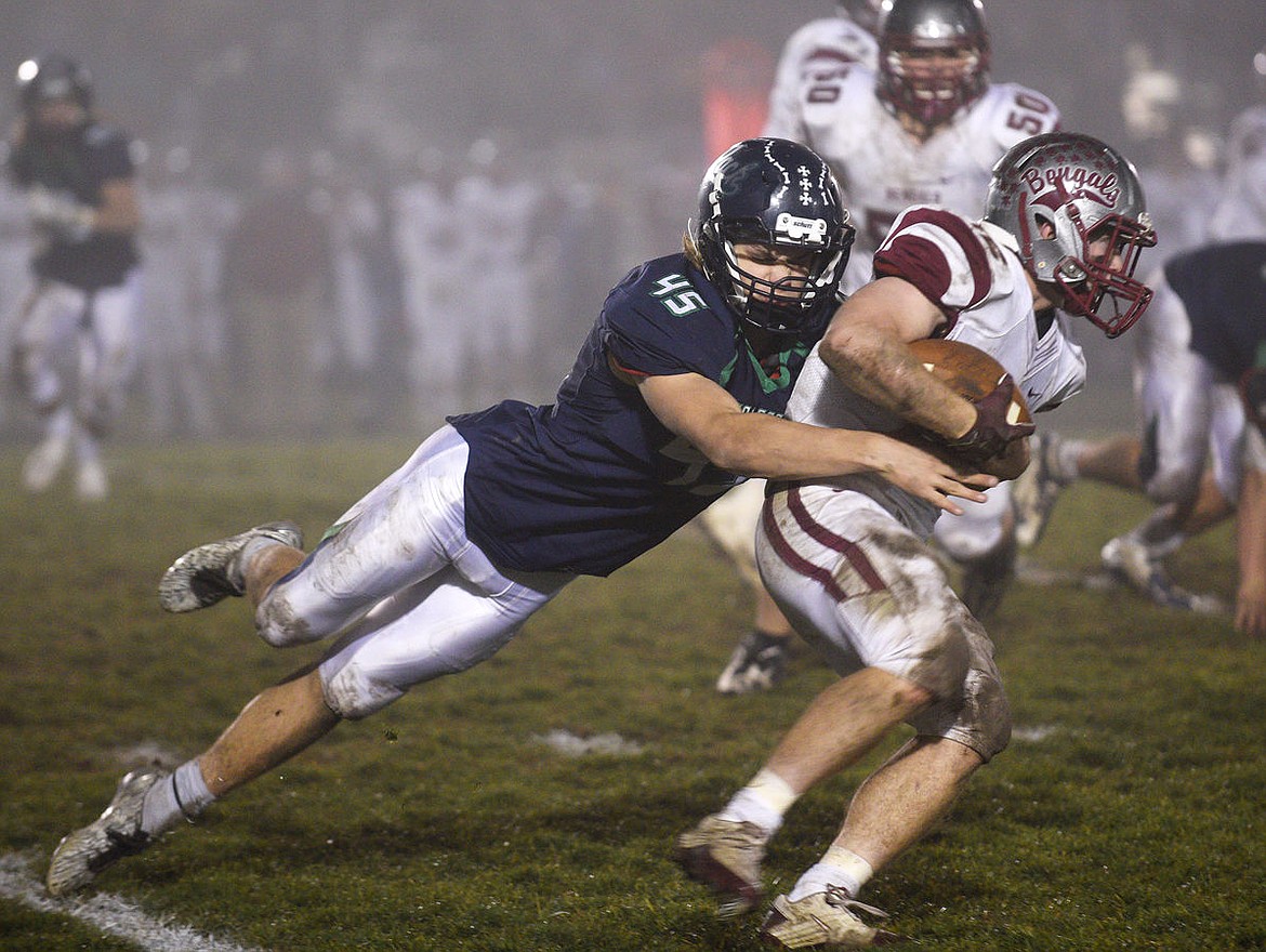 &lt;p&gt;Glacier's Ethan Baines hauls down Helena running back Ryan Arntson during the fourth quarter of the Wolfpack's 29-14 victory. (Aaric Bryan/Daily Inter Lake)&lt;/p&gt;