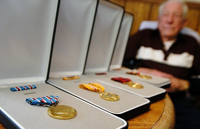 Smith earned four medals during his service in World War II, including Navy and Presidential Unit citations.