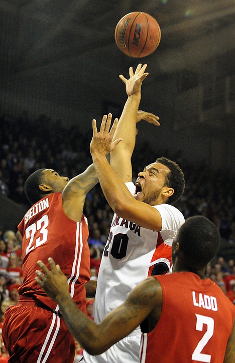 &lt;p&gt;Washington State's D.J. Shelton (23) tries to block Gonzaga's Elias Harris (20) as Washington State's Mike Ladd (2) stands by in the first half of an NCAA college basketball game, Monday in Spokane, Wash. Gonzaga won 89-81.&lt;/p&gt;