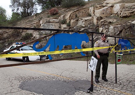 &lt;p&gt;FILE - In this March 6, 2013 file photo, an officer guards the gate near at the entrance of Cat Haven, the exotic animal park in central California where a 26-year old female volunteer intern was killed by a lion, in Dunlap, Calif. Over the past few decades, as an exotic animal trade boomed and Americans bought up cute tiger and bear cubs, wild animal sanctuaries sprang up throughout the nation to take care of those wild animals once they grew to adult-size and were abandoned. Some of these sanctuaries focused on rescuing big wild cats. In turn, the growth in the trade of exotic animals and the number of sanctuaries that rescued them led to more humans handling predatory species and fueled an increase in wild cat-related incidents. (AP Photo/Gosia Wozniacka, File)&lt;/p&gt;