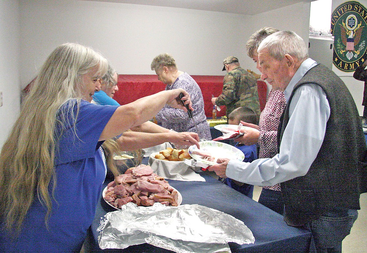 &lt;p&gt;Debbie Welcome, along with other workers, serving a free meal at the VFW in Troy on Veterans Day. (Bethany Rolfson/TWN)&lt;/p&gt;