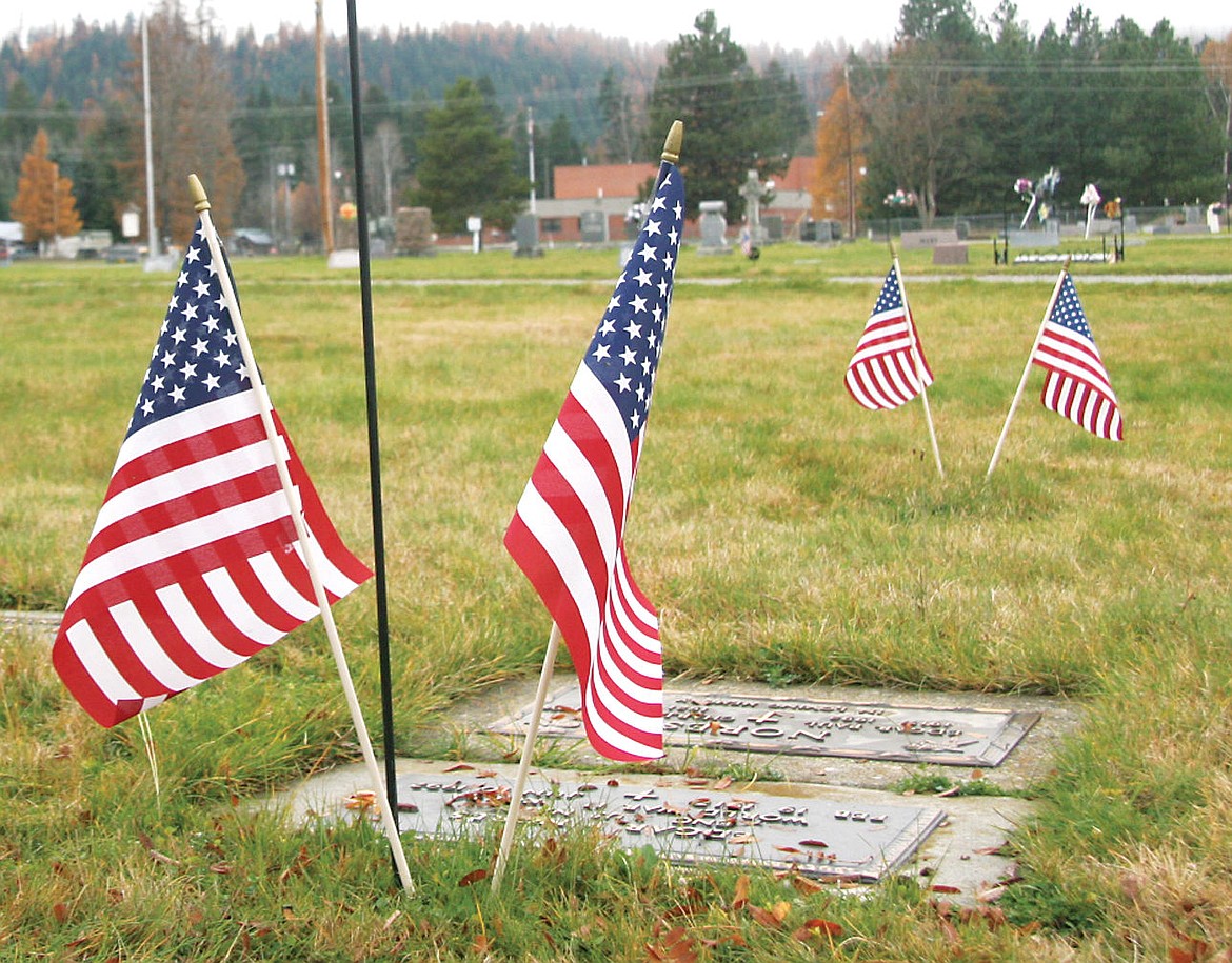 &lt;p&gt;American Flags stand on the graves of those who served in the Armed Forces at the veteran&#146;s section of the Libby Cemetery. (Bethany Rolfson/TWN)&lt;/p&gt;