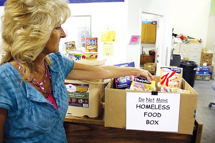 Peny Archer, operations manager for Community Services of Moses
Lake, looks over food bank items to be given to the homeless.
Archer and other advocates say the need for a homeless shelter is
great in the Moses Lake area.