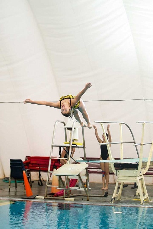 The Chiefs Heather Carbon performs on the 1-meter diving board during the swim meet against Wenatchee earlier this year. The Moses Lake School Board is reviewing its options for replacing the pool cover. For more photos, visit <a href="http://www.instantimagegallery.com/iig/a/193/295343">click here</a>.