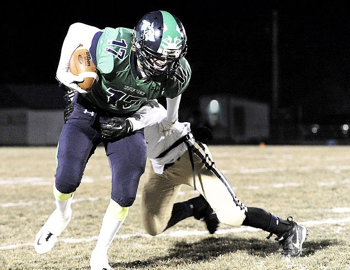 &lt;p&gt;Glacier wide receiver Noah Lindsay tries to shake Big Sky's Kolton Sandau after a catch during the first quarter. (Aaric Bryan/Daily Inter Lake)&lt;/p&gt;