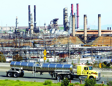 &lt;p&gt;Chevron oil refinery in Richmond, Calif. On Wednesday, California?s largest greenhouse gas emitters will for the first time begin buying permits in a landmark ?cap-and-trade? system meant to control emissions of heat-trapping gases and spur investment in clean technologies. The program is a key part of California?s 2006 climate-change law, AB32, a suite of regulations that dictate standards for cleaner-burning fuels, more efficient automobiles and increased use of renewable energy.&lt;/p&gt;