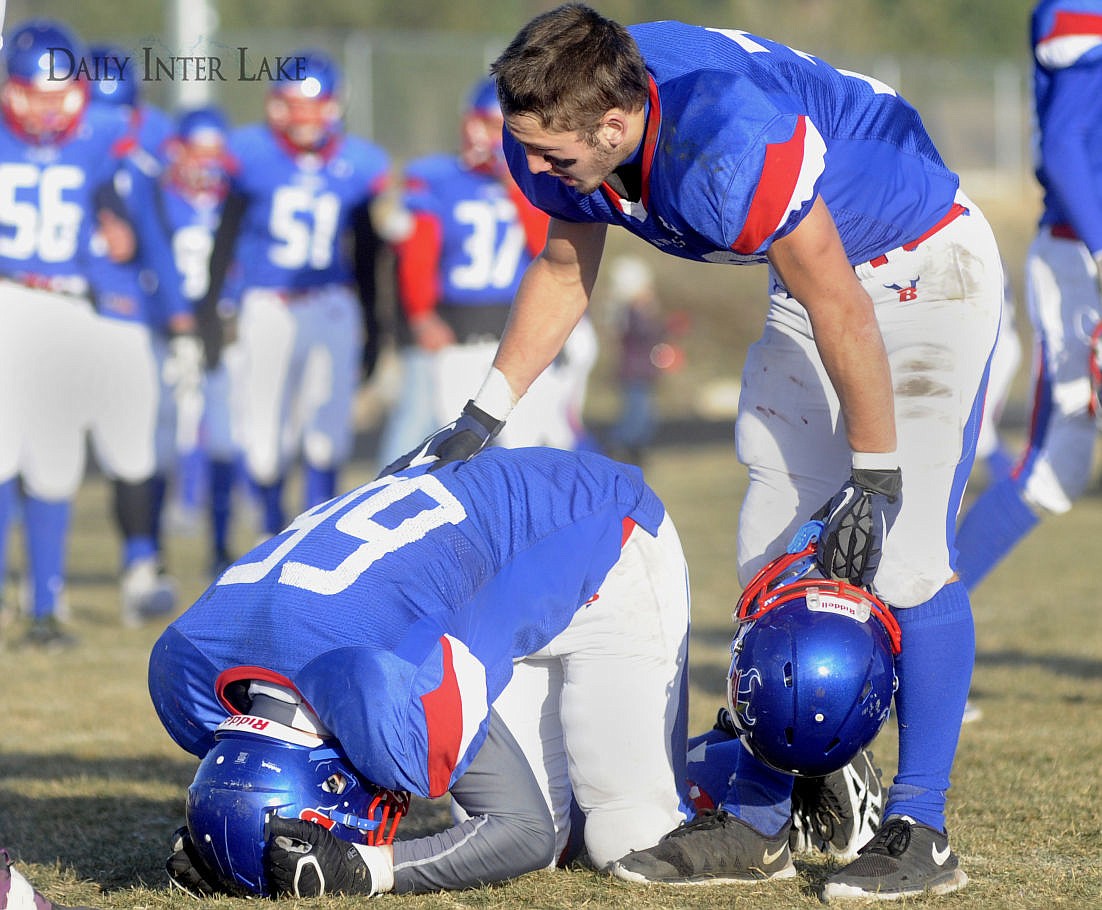 &lt;p&gt;Bigfork's Logan Mejak (66) is consoled by Matthew Farrier after the Vikings' 27-6 loss to Huntley Project in the Class B semifinals on Saturday. (Aaric Bryan/Daily Inter Lake)&lt;/p&gt;