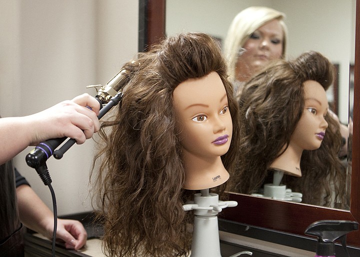 &lt;p&gt;Kimberly Carpenter, a student at the Pela Beauty Academy, curls
the hair of a &quot;Molly Head&quot; Monday morning at the Pela Beauty
Academy in the Mountain Mall in Whitefish. The heads are made with
real hair that is processed to withstand heat.&lt;/p&gt;