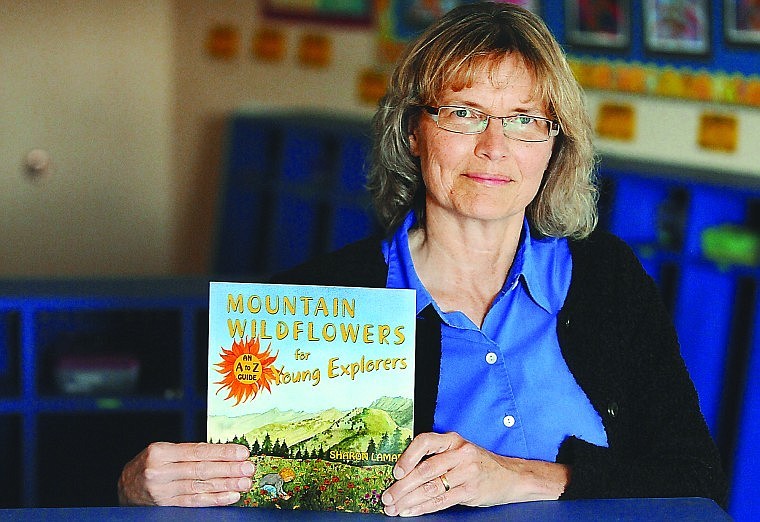 &lt;p&gt;Sharon Lamar, a teacher at Bigfork Elementary, displays her new
book, &quot;Mountain Wildflowers for Young Explorers.&quot;&lt;/p&gt;