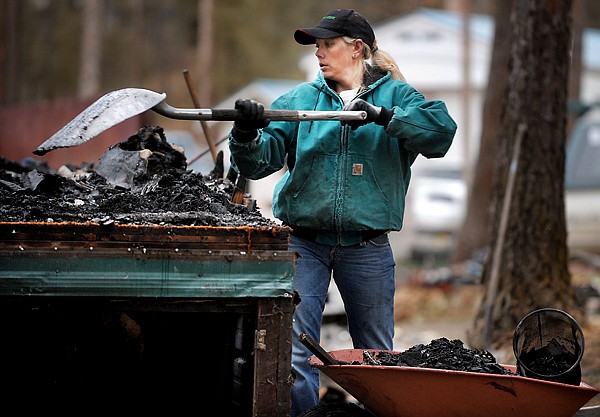 &lt;p&gt;Crystal Pengelly, wife of Ryan Pengelly, uses a shovel to remove
debris from what was her home on Saturday afternoon in Forest Acres
south of Whitefish.&lt;/p&gt;