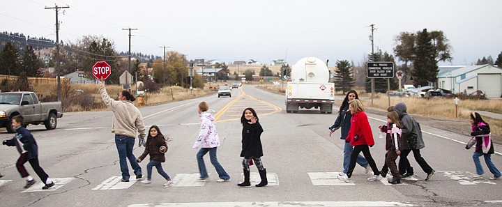 &lt;p&gt;Tricia Lake, left, helps students cross U.S. 2 after completing
their weekly fundraising walk on Monday afternoon. The students are
part of the 500 Mile Club, a program designed to get children
active while also raising money for Smith Valley School&#146;s Parent
Teacher Club.&lt;/p&gt;