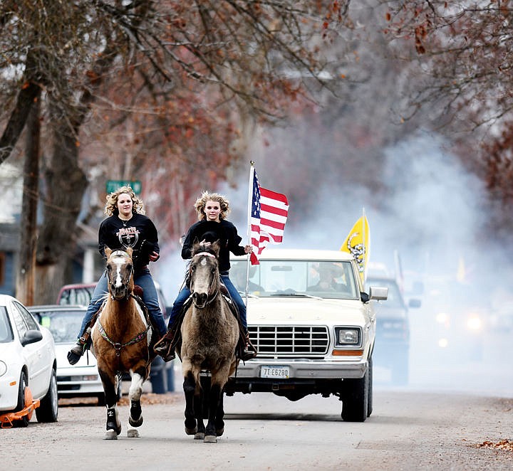 &lt;p&gt;Columbia Falls senior Darien Matthews, left, and Flathead senior Arielle Peters riding on horseback and leading an unofficial procession of students from behind Flathead High School to Legends Stadium in honor of fellow student Zachary Rhoads who was killed in a three-vehicle accident near Marion on Saturday, November 12. (Brenda Ahearn/Daily Inter Lake)&lt;/p&gt;