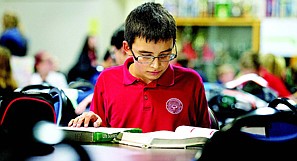 &lt;p&gt;Raziel Sepulveda, 12, hits the books during study hall at Coeur d'Alene Charter Academy Thursday.&lt;/p&gt;