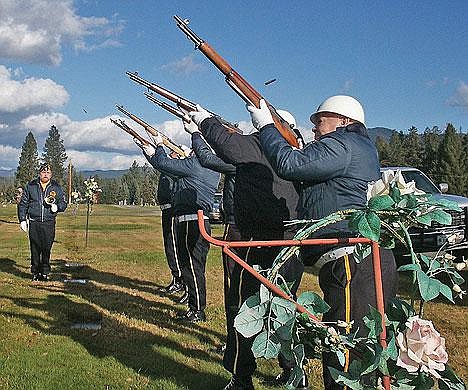 Casings fly as an honor guard of veterans fires off a round of shots Friday in Libby Cemetery during Veterans Day ceremonies.