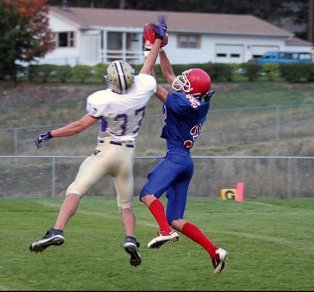 Goofy Erickkson snatches the ball from the hands of a Cut Bank defender in the Bobcat's homecoming game.