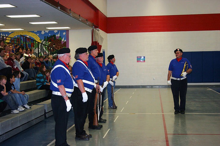 Ed Heppe commands Doug Cummings, HF Berneking, Churck Case, Gary Chambers and Rhandy Kryzsko during the assmebly on Veteran's Day at Superior Elementary.
