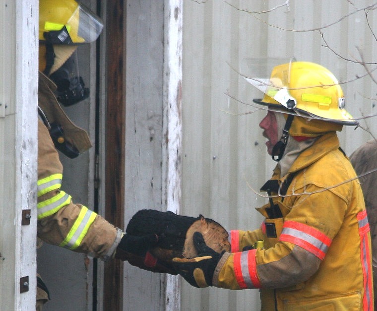 &lt;p&gt;Plains firemen take the burnt firewood out of the basement
Thursday after putting out a house fire caused by the wood stacked
too close to the fireplace.&#160;&lt;/p&gt;