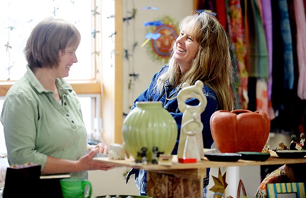 &lt;p&gt;From left, Karen Moon and her sister-in-law Kristen Turner share a laugh at the Ten Thousand Villages International Gift Festival on Thursday, November 14 at the Mennonite Church in Creston. The festival is an annual event continues today from 10 a.m. to 8 p.m. and and Saturday from 9 a.m. to 5 p.m. This is the first year the festival will be accepting credit and debit cards. (Brenda Ahearn/Daily Inter Lake)&lt;/p&gt;