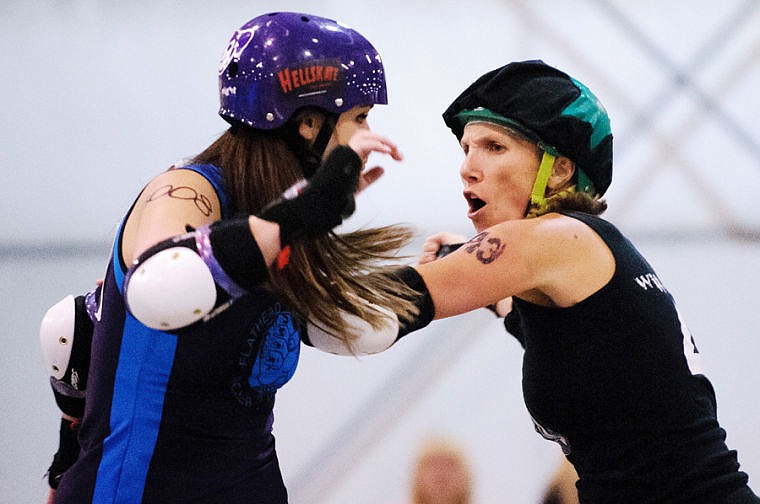 &lt;p&gt;Big Mountain Misfits blocker Armando Roll (left) holds off Snake Pit Derby Dames jammer Wiffle Whips Saturday afternoon during the roller derby bout in the Trade Center at the Flathead Valley Fairgrounds in Kalispell. Nov. 16, 2013 in Kalispell, Montana. (Patrick Cote/Daily Inter Lake)&lt;/p&gt;