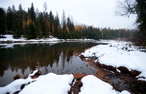 &lt;p&gt;The calm waters of McDonald Creek flow between snow-covered banks on Tuesday in Glacier National Park.&lt;/p&gt;