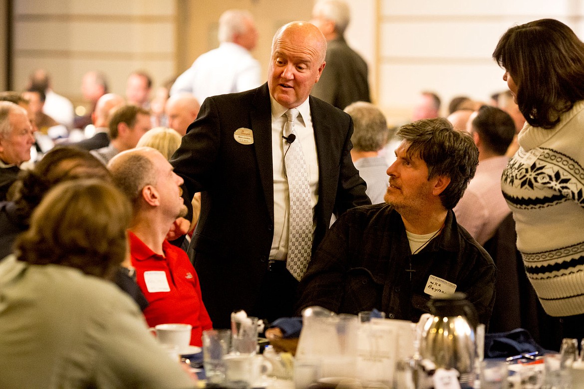 &lt;p&gt;Mark Conklin, leadership development director for Chick-fil-A, visits with Kris Siebers, left, and Mike Beymer, right, of KYMS Radio before giving the keynote speech at The Business Forum luncheon Thursday at The Coeur d'Alene Resort.&lt;/p&gt;