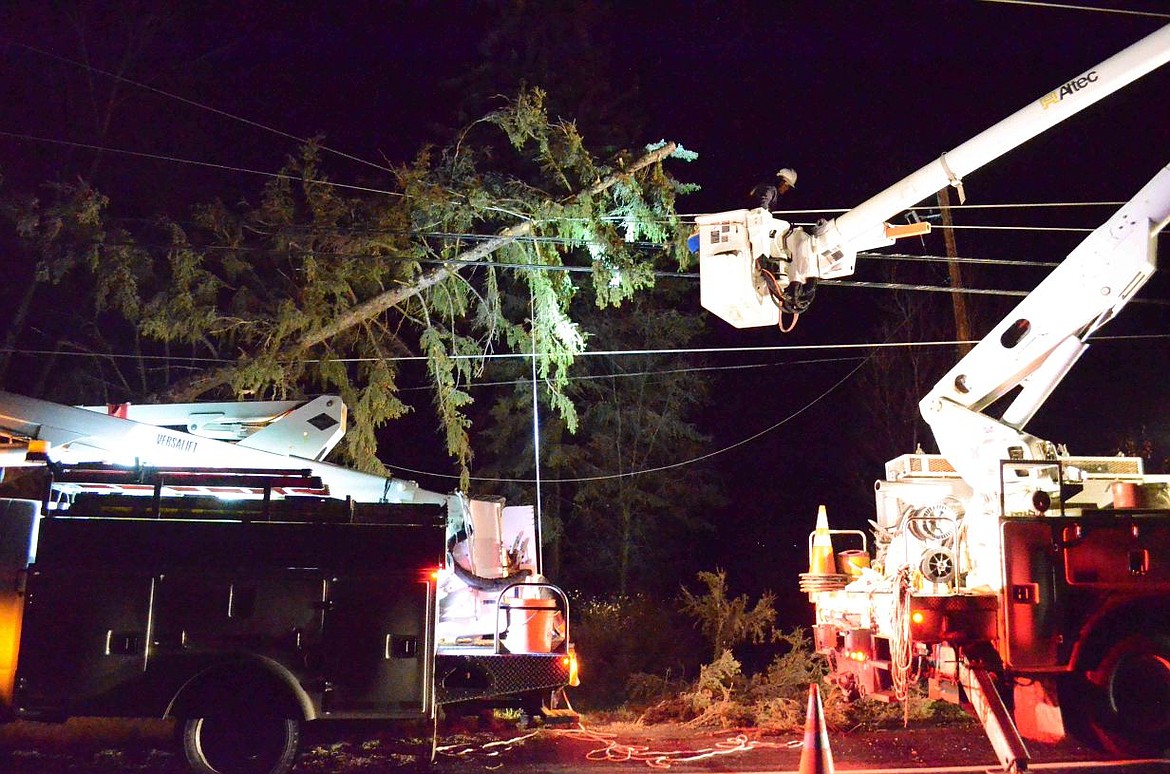 &lt;p&gt;&lt;strong&gt;Flathead Electric&lt;/strong&gt; Cooperative linemen work on a downed tree on Montana 35 south of Bigfork Tuesday night. (Seaborn Larson/Daily Inter Lake)&lt;/p&gt;