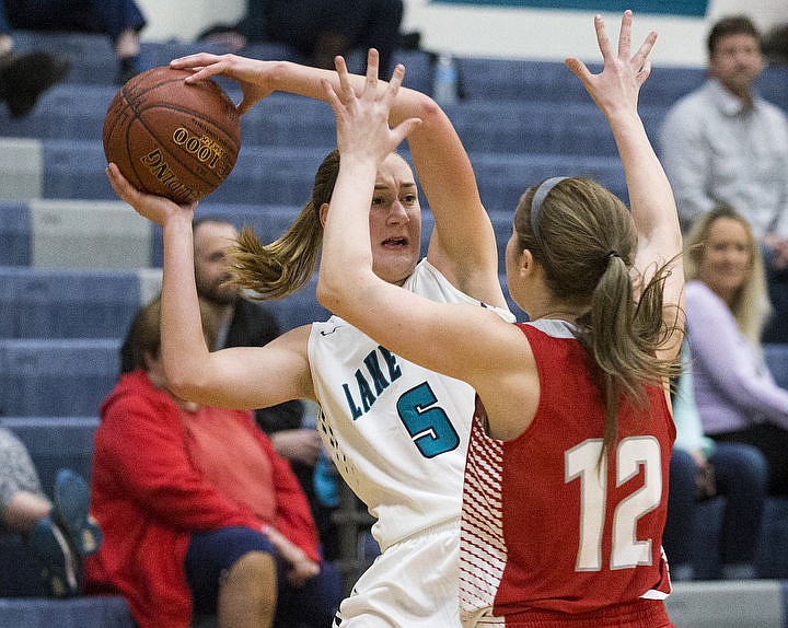 &lt;p&gt;LOREN BENOIT/Press Lake City High School beat the Sandpoint Bulldogs 57-28 behind Bridget Rieken's 13 points,18 rebounds, and Lauren Rewers' 17 points in the Timberwolves' season home opener.&lt;/p&gt;