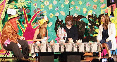 &lt;p&gt;The famous Alice in Wonderland &#147;tea time&#148; scene, with Mad Hatter John Fossen, March Hare Andrea Horton, Dormouse Lucas Avidiya and Janya Comer, playing Alice. (Bethany Rolfson/TWN)&lt;/p&gt;