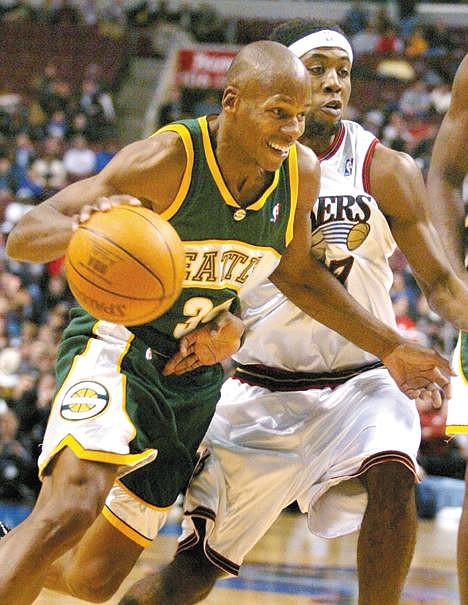 Philadelphia 76ers' John Salmons, right, fouls Seattle SuperSonics' Ray Allen as he tries to keep Allen from the basket in the first half Tuesday, Nov. 16, 2004, in Philadelphia. (AP Photo/Rusty Kennedy)