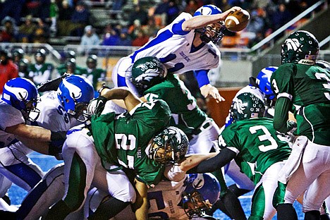 &lt;p&gt;Coeur d'Alene High quarterback Chad Chalich goes up and over place the ball over the goal line to score a touchdown in the fourth quarter.&lt;/p&gt;