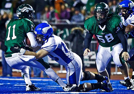 &lt;p&gt;Dillon Bradley from Coeur d'Alene High wraps up Eagle's quarterback Tanner Mangum for a sack.&lt;/p&gt;