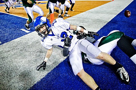 &lt;p&gt;Coeur d'Alene High's Joe Roletto gets pulled out of bounds by an Eagle defender just short of the goal line after an one of his three interceptions in the championship game.&lt;/p&gt;