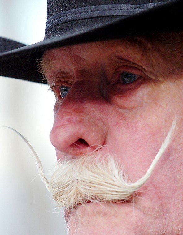 Grandfather Gary Weller has tears in his eyes after attaching mementos to Marica Weller&#146;s roadside cross.