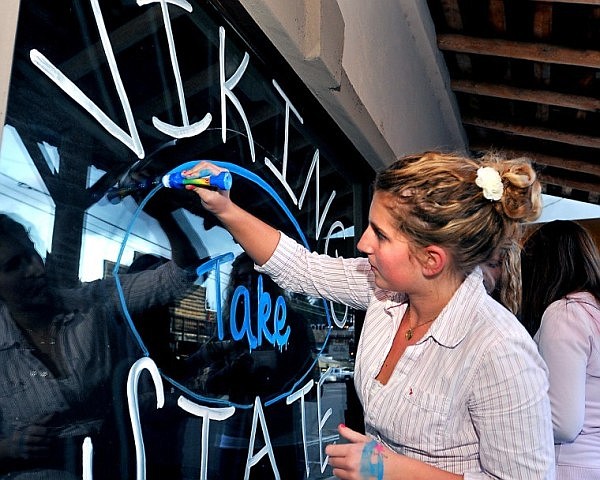 Ariel Stallknecht, 17, outlines a football on a window at the Swan River Inn in Bigfork on Thursday afternoon. Bigfork High School is playing in the Class B State Championship game against Fairfield at home on Saturday at 1 p.m, with hopes of bringing home a state football title to the Flathead Valley for the first time in 31 years.