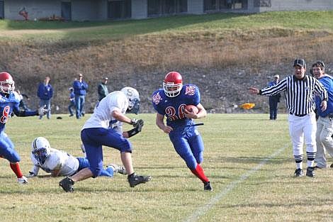 Nick Ianniello/Mineral Independent Superior Bobcat Drew Walen braces for a hit from Scobey Spartan Brady Henderson that knocked him out of bounds during Saturday's playoff game. The Bobcats won the game 56-0 and advanced to the final game of the playoff season.