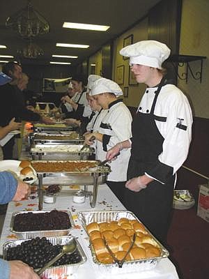 Chrystal Doucette/Columbia Basin HeraldColumbia Basin Job Corps students serve up a free Thanksgiving feast at Elks Lodge in 2007.