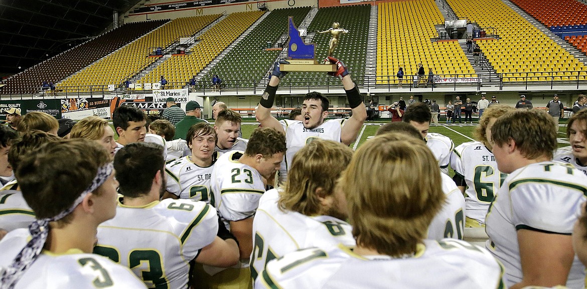 &lt;p&gt;STEVE CONNER/Steve Conner Photography&lt;/p&gt;&lt;p&gt;Brady Martin of St. Maries celebrates with teammates with the state championship trophy after the Lumberjacks beat Declo on Friday night at Holt Arena in Pocatello for their first state football title.&lt;/p&gt;