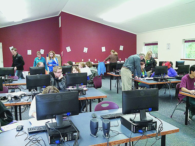 &lt;p&gt;A group of seniors works on completing college applications on Wednesday, November 13th. During College Application Week, 18 colleges either waived or deferred their fees so that students could apply without worrying about money.&lt;/p&gt;