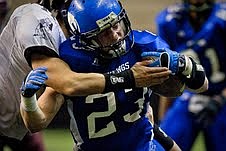 &lt;p&gt;Coeur d'Alene High running back Zach Keiser pushes through a tackle for more yardage during the second half.&lt;/p&gt;