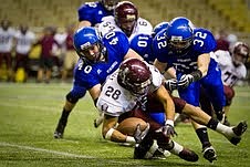 &lt;p&gt;Coeur d'Alene High's John Haines (40) tops Centennial's Mike Kirby in the backfield with an assist from teammate JJ Johnson (32)&lt;/p&gt;