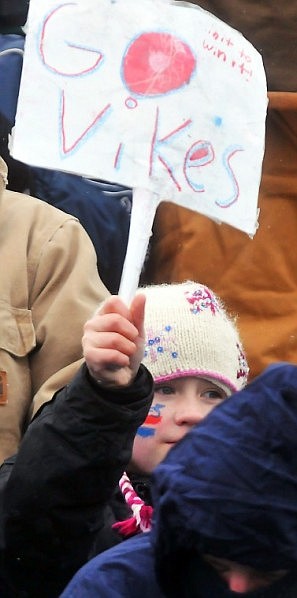 Kayli Galbraith, 10, holds up her sign in support of the Vikings in the stands.