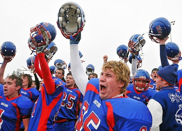 The Bigfork Vikings raise their helmets after taking the Class B Championship.