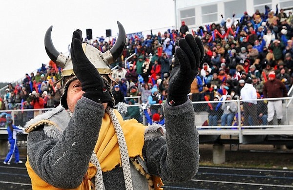 Dressed in Viking attire, Michael Roessmann puts his hands together before the start of the game.