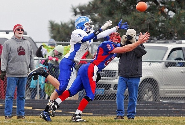 With Fairfield on offense, a thrown ball comes just out of reach of Fairfield's Colby Hardin (7) and Bigfork's Ian Lorang.