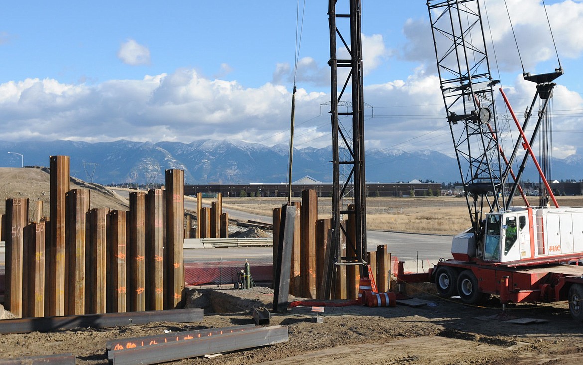 &lt;p&gt;&lt;strong&gt;A crane&lt;/strong&gt; on Wednesday moves a beam being used for 65-foot pilings that will be part of a U.S. 93 bypass bridge that will span Old Reserve Drive on Wednesday. (Aaric Bryan/Daily Inter Lake)&lt;/p&gt;