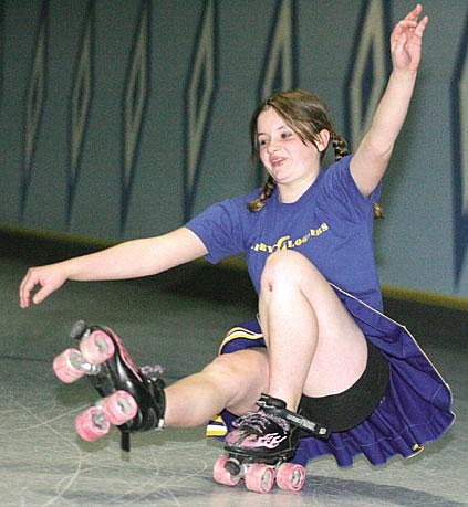 Kaya Hardgrove, 13, captain of the Libby Middle School cheer squad, has fun while roller skating this past Sunday at the Carousel Roller Rink. The squad was hosting a skating fundraiser.